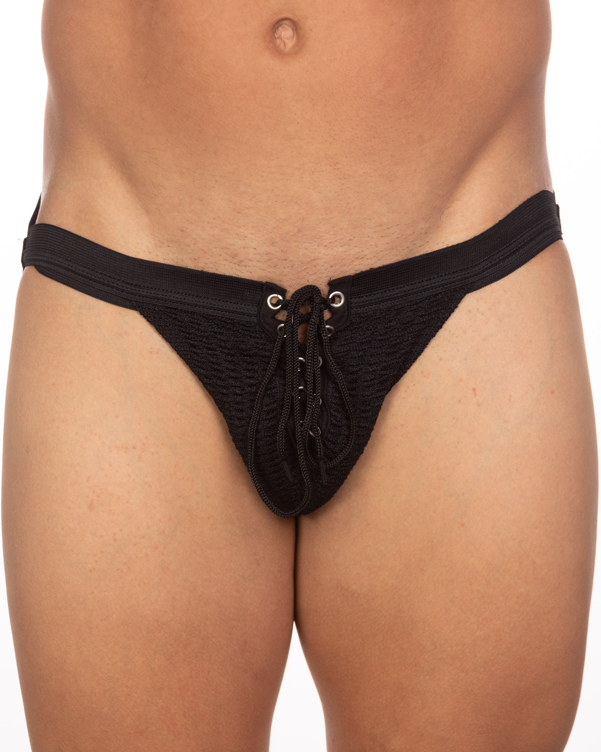 Black lace-up thong with textured fabric and metallic eyelets from undergear fizx mark solid knit jockstrap collection