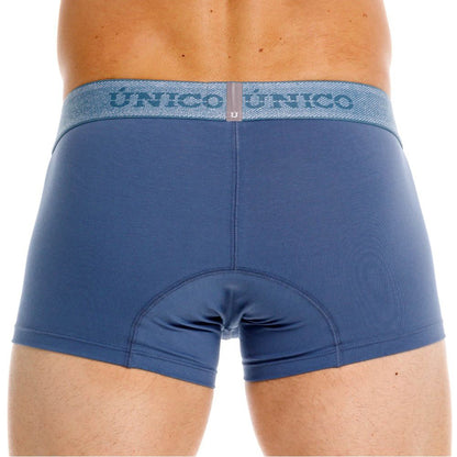 Blue unico boxer briefs with a textured gray waistband featuring the brand name in teal premium everyday trunks