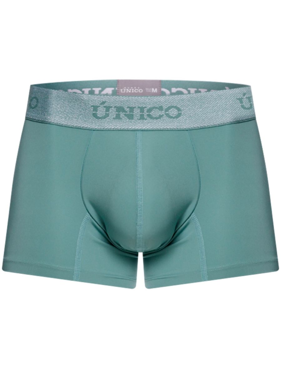 Teal ceramic trunks with a silver glittery waistband featuring unico brand logo color 43 green