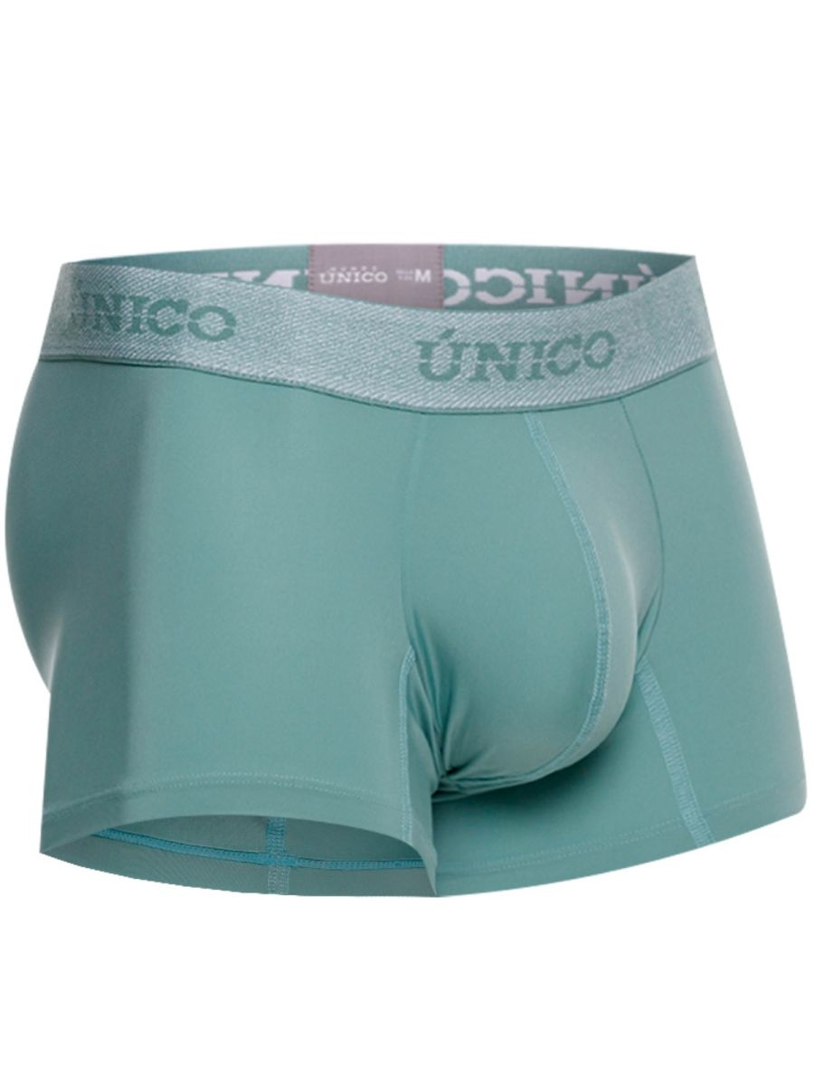Teal men’s ceramic trunks with a silver waistband featuring the único brand name in green color 43