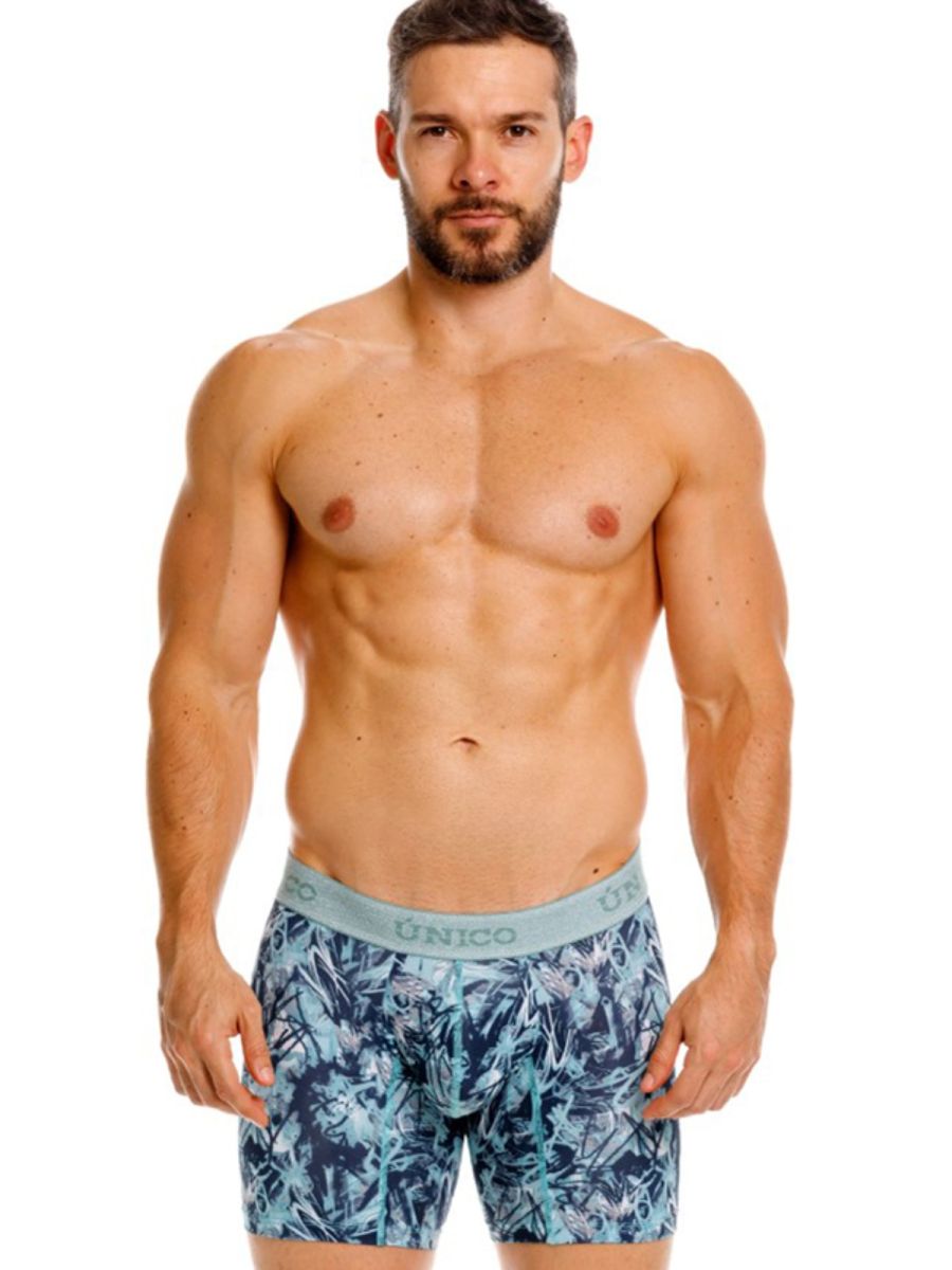 Men’s blue and teal tropical leaf boxer briefs with a light gray unico waistband in color 43-blue