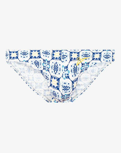 Blue and white patterned swim brief with decorative tile design ideal for beach and pool use