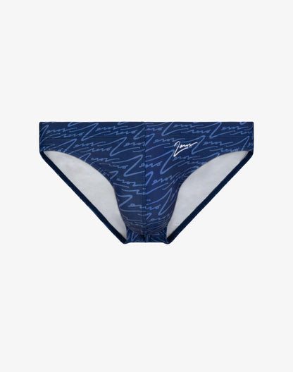 Dark blue V20 signature print swim brief with repeating white cursive script pattern and white interior lining