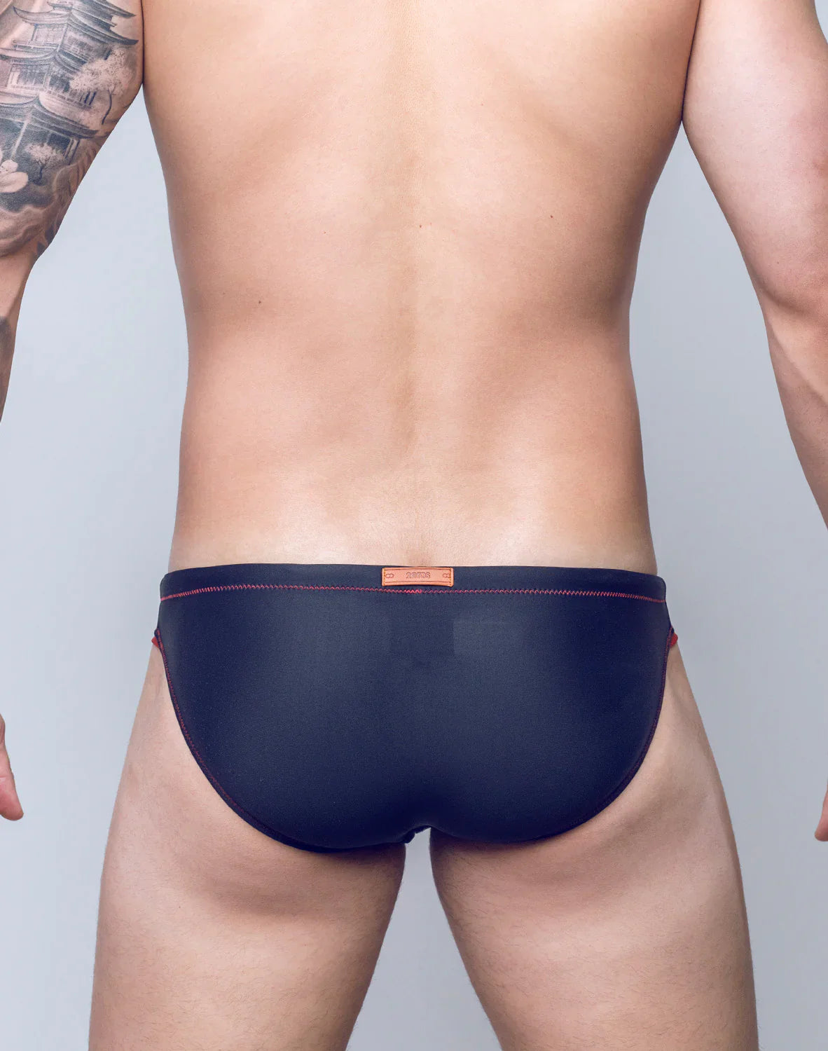 Navy blue V22 rapid swim briefs with red stitching and an orange brand tag at the waistband for quick drying