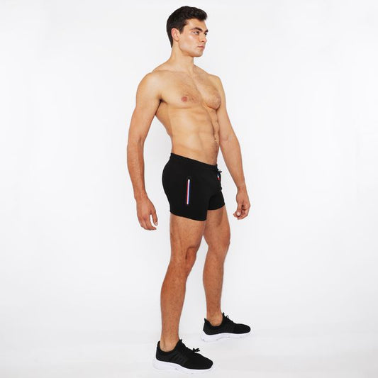 Black vault gym-tech shorts with vertical stripe detail and three color heat weld zippers for athletic use