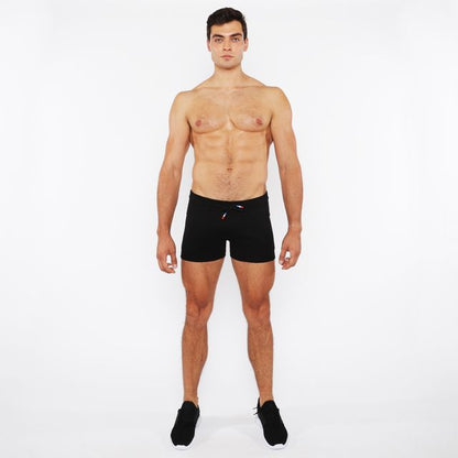 Black vault gym-tech athletic shorts with three color heat weld zippers and small red and white logo on waistband