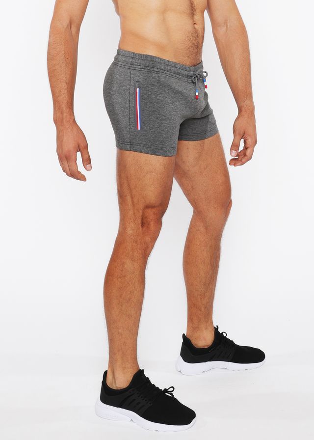 Gray vault gym-tech shorts with drawstring waistband and red white blue vertical stripe heat weld zippers on side