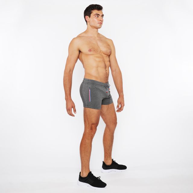Gray vault gym-tech shorts with drawstring waist and subtle vertical stripe detailing featuring 3 color heat weld zippers