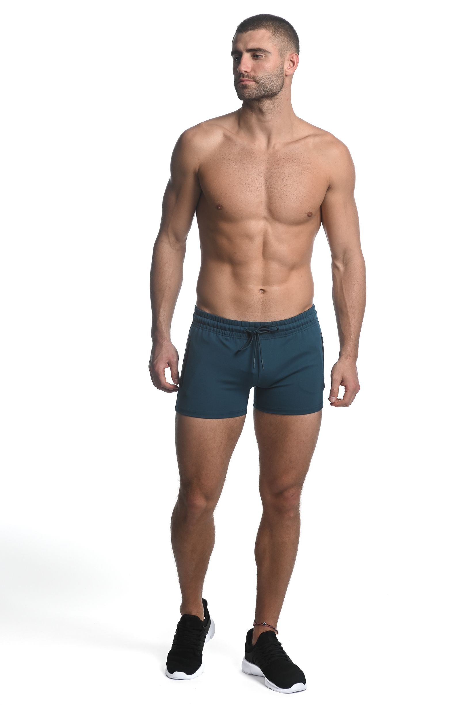 Dark teal vault gym-tech stretch shorts with drawstring waistband and heat weld zippers for athletic use