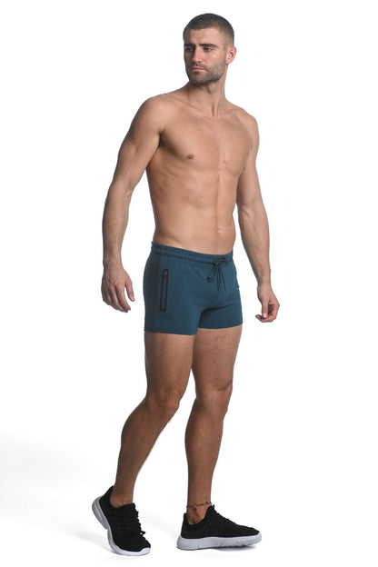 Teal vault gym-tech stretch shorts with heat weld zippers featuring drawstring waist and side zipper pockets