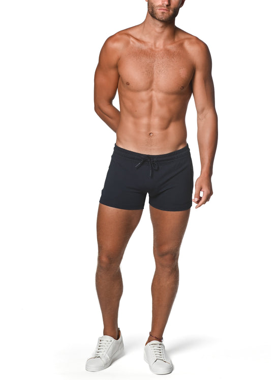 Black drawstring vault gym-tech stretch swim trunks with heat weld zippers designed for active use