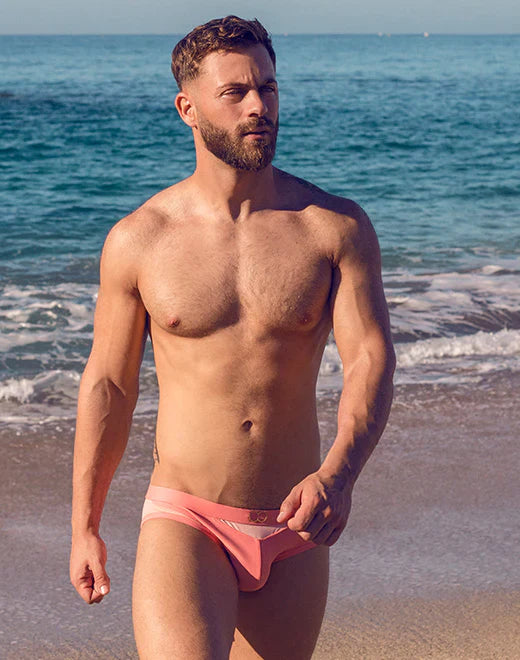 Pink VB13 swim brief with subtle white stripe detail designed for comfortable beach and poolwear