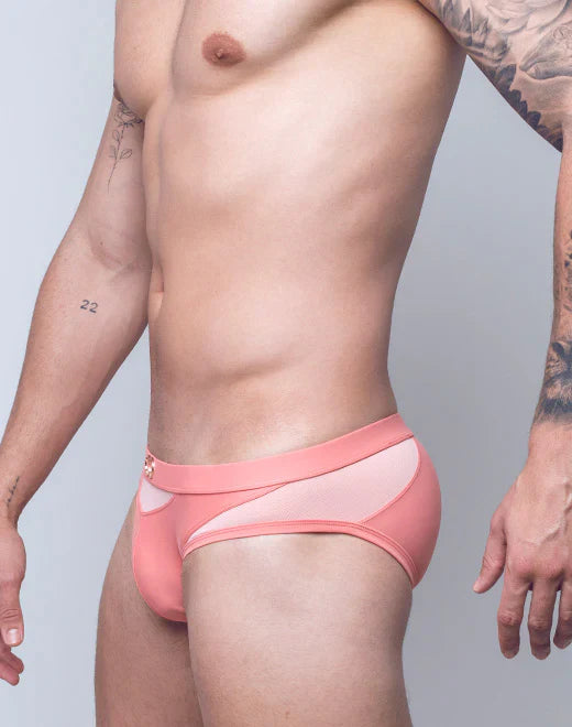 Pink vb13 swim brief with sheer mesh panel and small gold logo on waistband designed for athletic use
