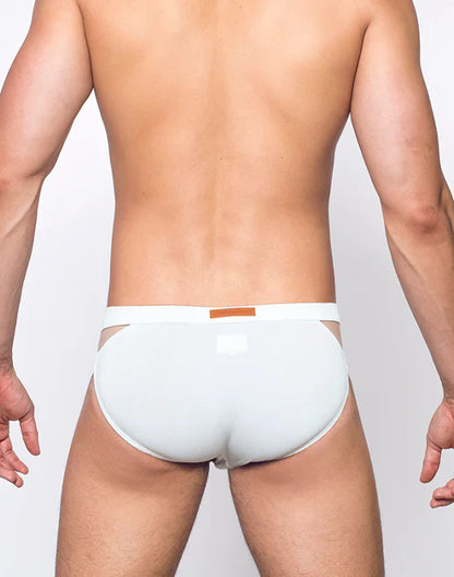 White men’s VB21 blk label swim brief with thin waistband and orange rectangular tag in breathable fabric