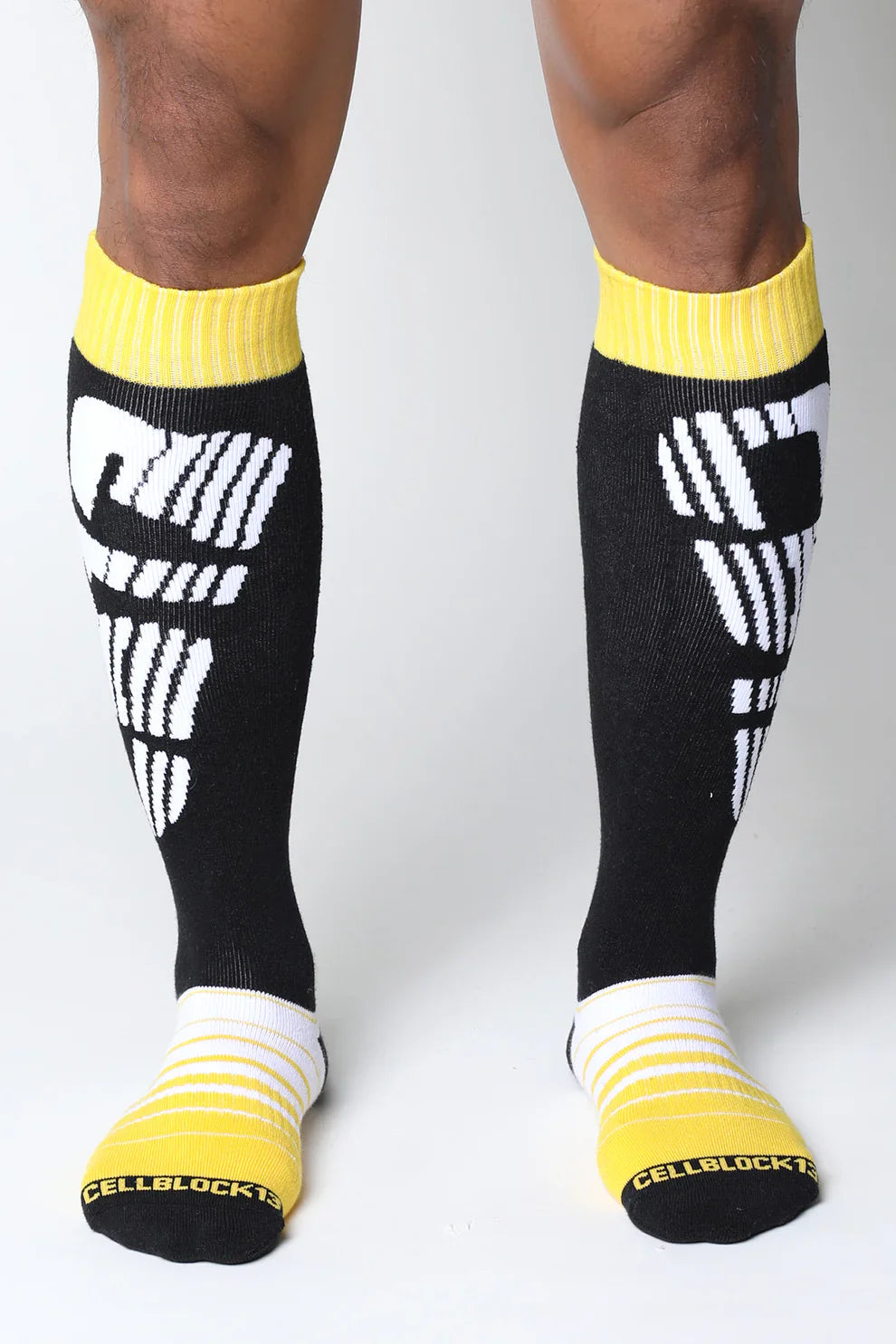 Velocity 2.0 knee high socks in black with bold white graphics and bright yellow ribbed cuffs toe caps and heel accents