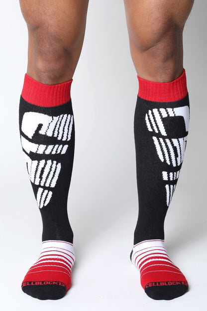 Velocity 2.0 black knee high socks with white cellblock 13 logo and red ribbed cuffs and toe sections