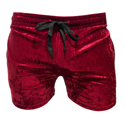 Rich red velvet pocket shorts with black drawstring waistband made from soft velvet material