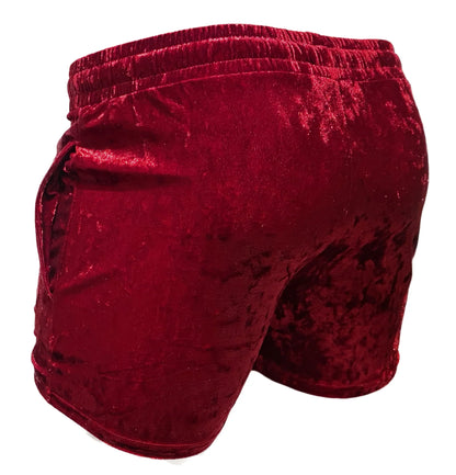 Rich burgundy velvet pocket shorts with plush textured fabric and elastic waistband for comfortable wear