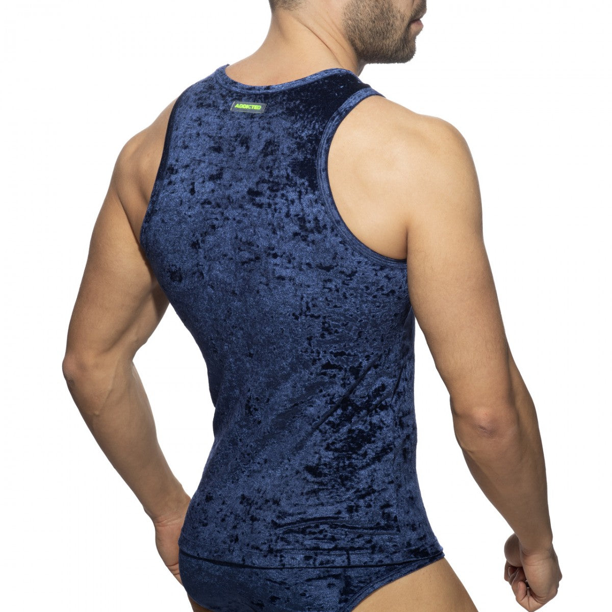 Deep blue velvet shady tank top with textured crushed appearance and small green brand tag at the neckline