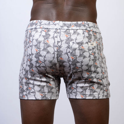 Vintage stripes linen texture shorts in gray and white pattern with subtle orange accent and elastic waistband