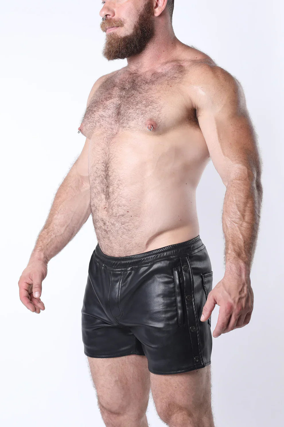 Black leather void snap up short with sleek glossy finish and side pockets with vertical zipper details