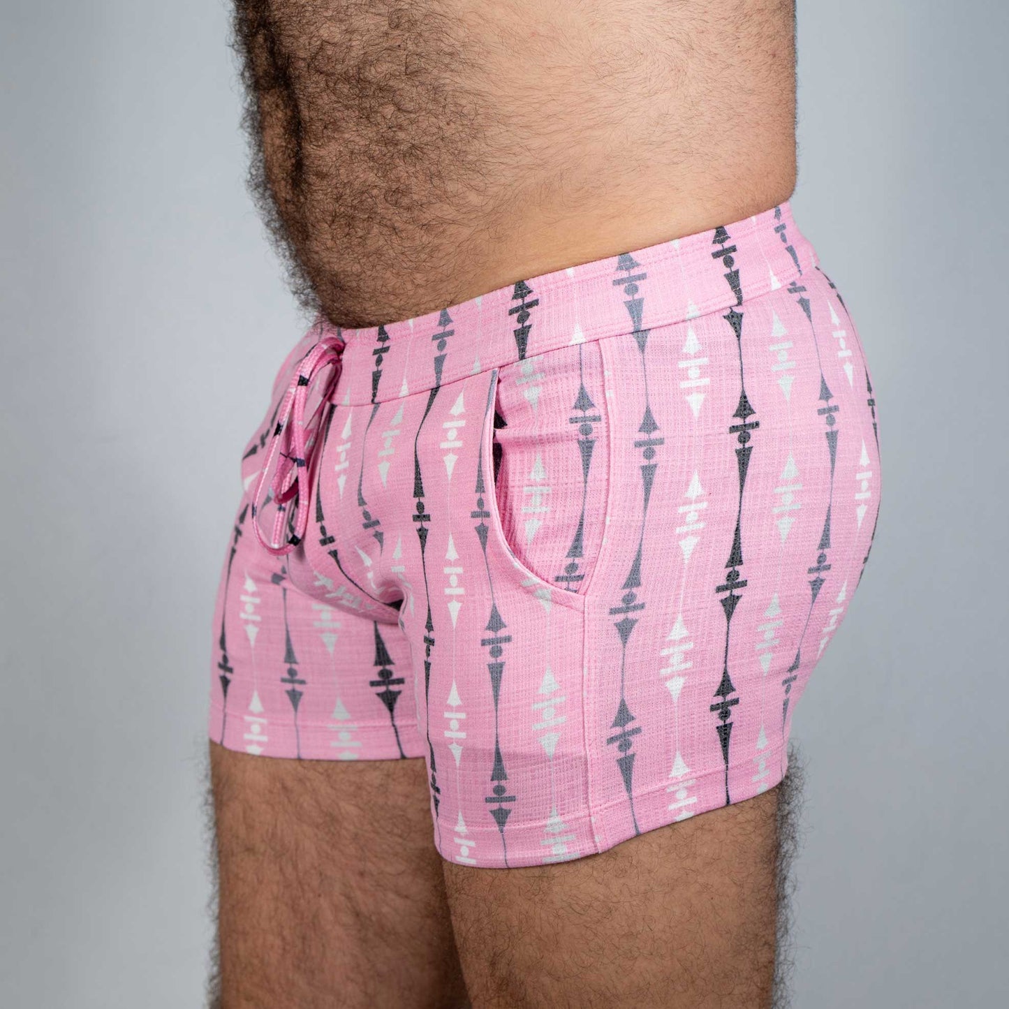 Pink wallpaper print linen texture shorts with black and white geometric pattern side pockets and drawstring waistband