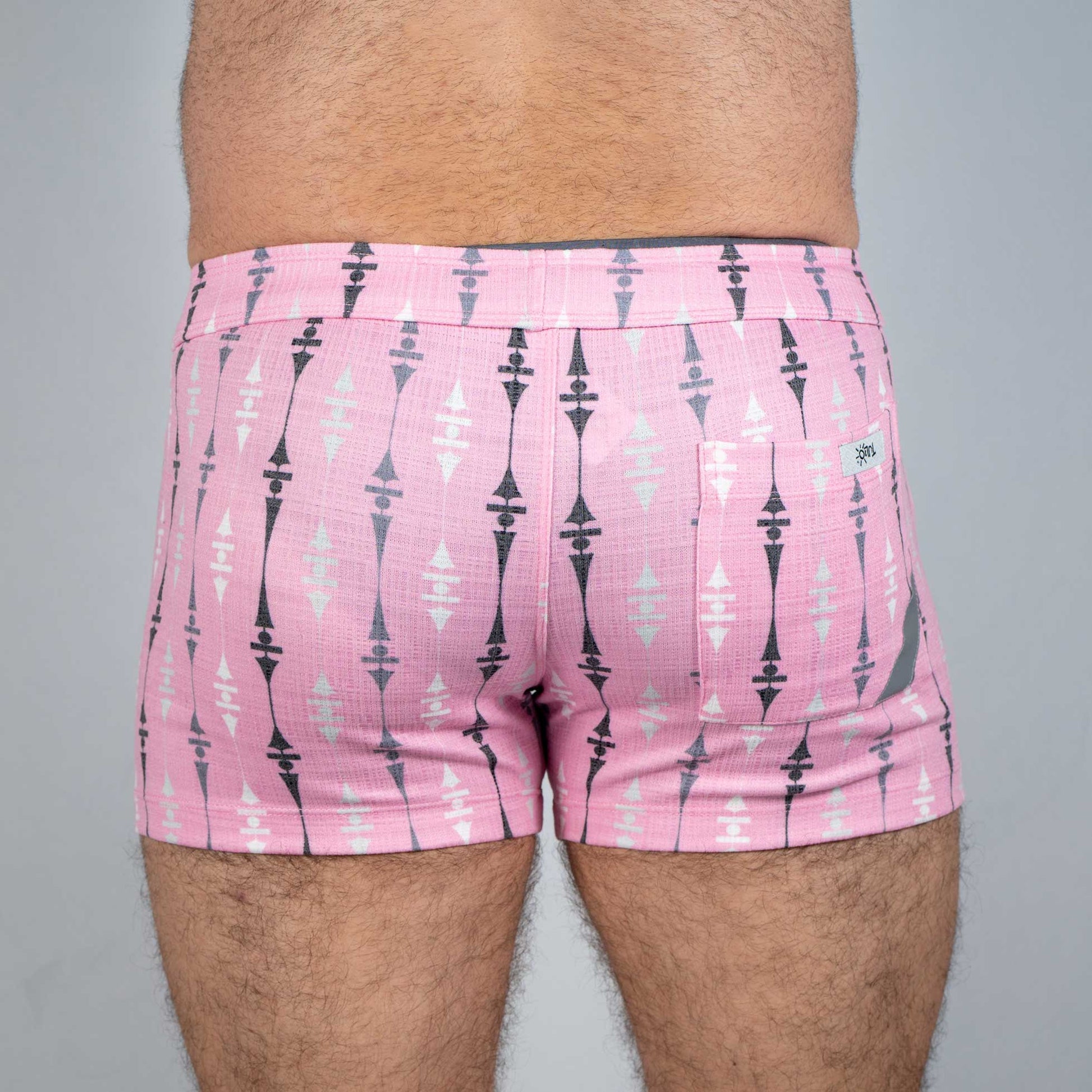 Pink wallpaper print linen texture shorts with black and white geometric pattern side pocket and small brand tag