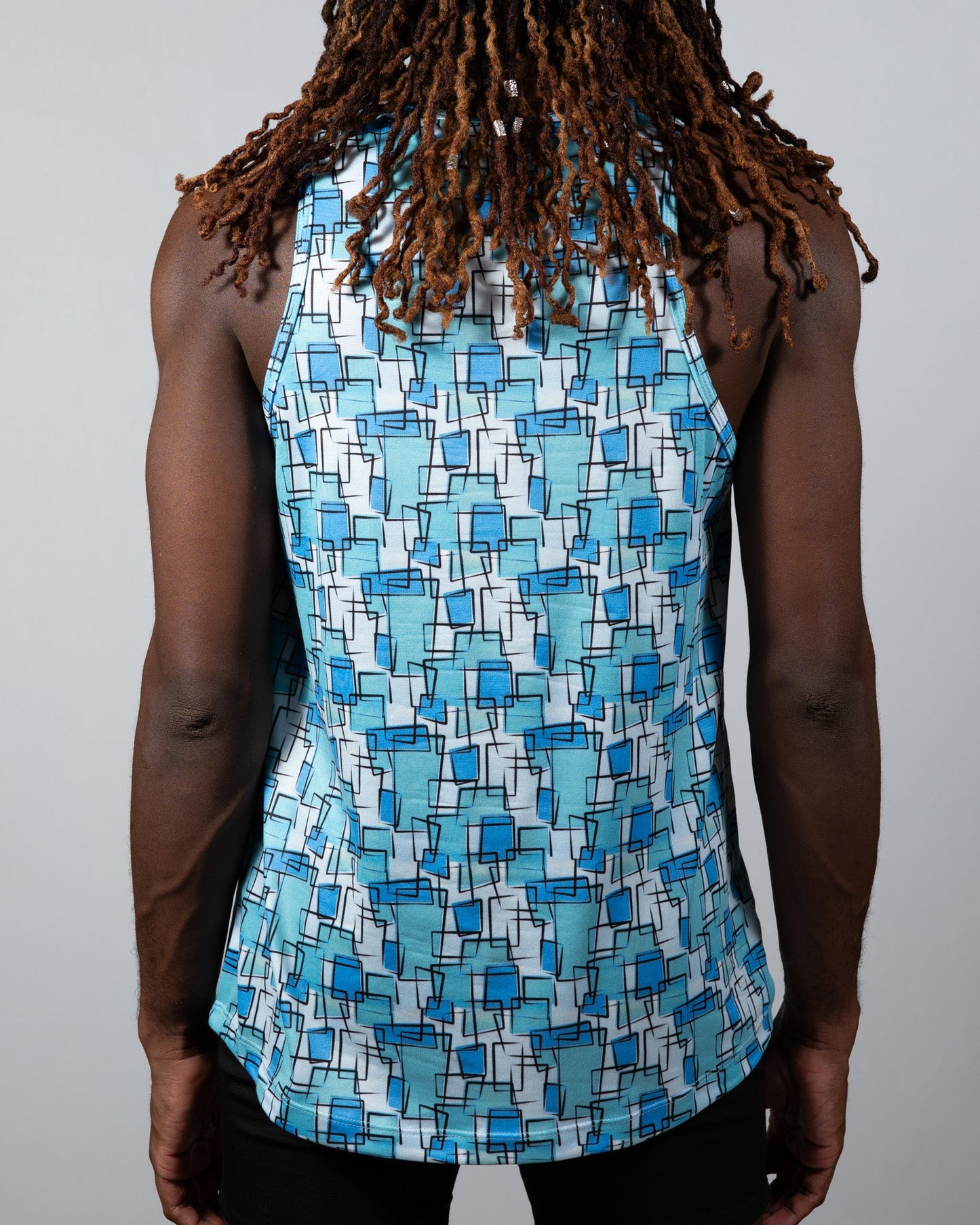 A blue and white geometric patterned wallpaper print tank sleeveless top ideal for casual summer wear