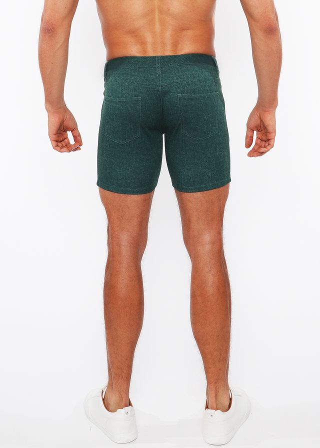 Dark green washed denim stretch knit shorts back side with subtle textured pattern and two back pockets