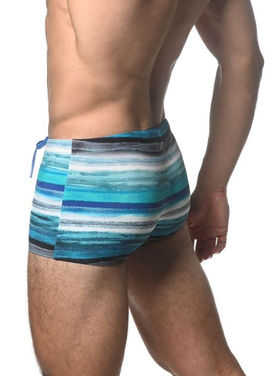 Blue and white striped watercolor stripe printed swim trunk with textured pattern for beach and pool use