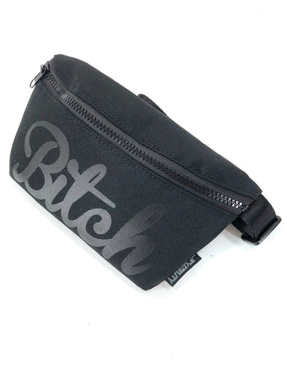 Black fabric WERDS ultra slim fanny pack with gray cursive bitch graphic and zipper closure