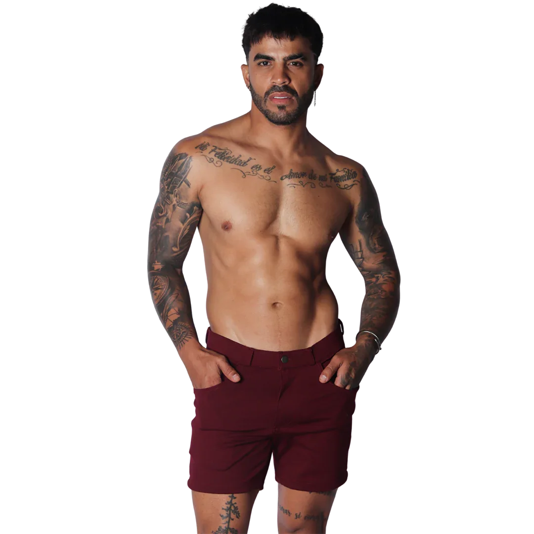 Wine-colored tailored shorts featuring a flat front, button closure, and slim-fit silhouette.