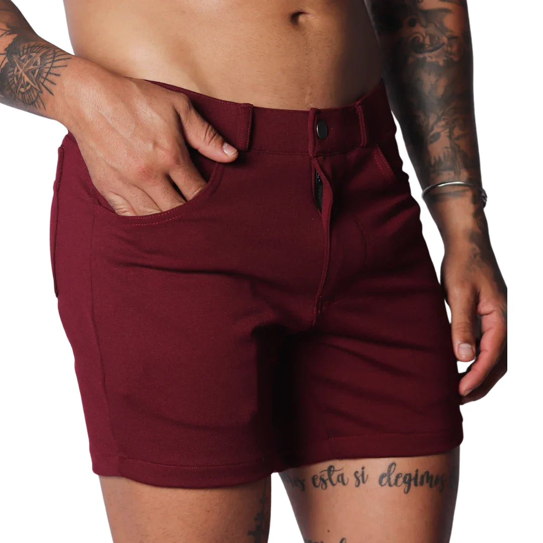 Wine-colored, short-length casual shorts in a smooth, stretch fabric with a button-fly closure and belt loops.