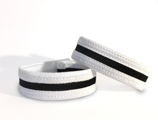 Two white and black elastic slim cock rings with stitched detailing, set against a plain white background.