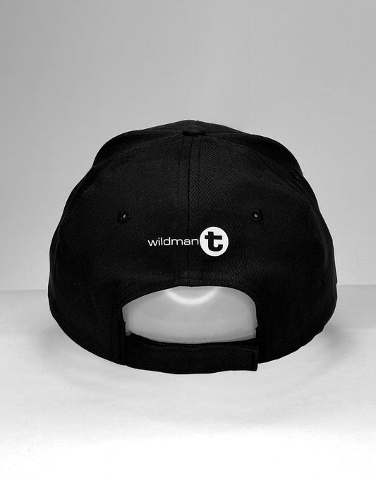 Black wildman t ball cap with white logo and circular emblem on the back side for casual wear