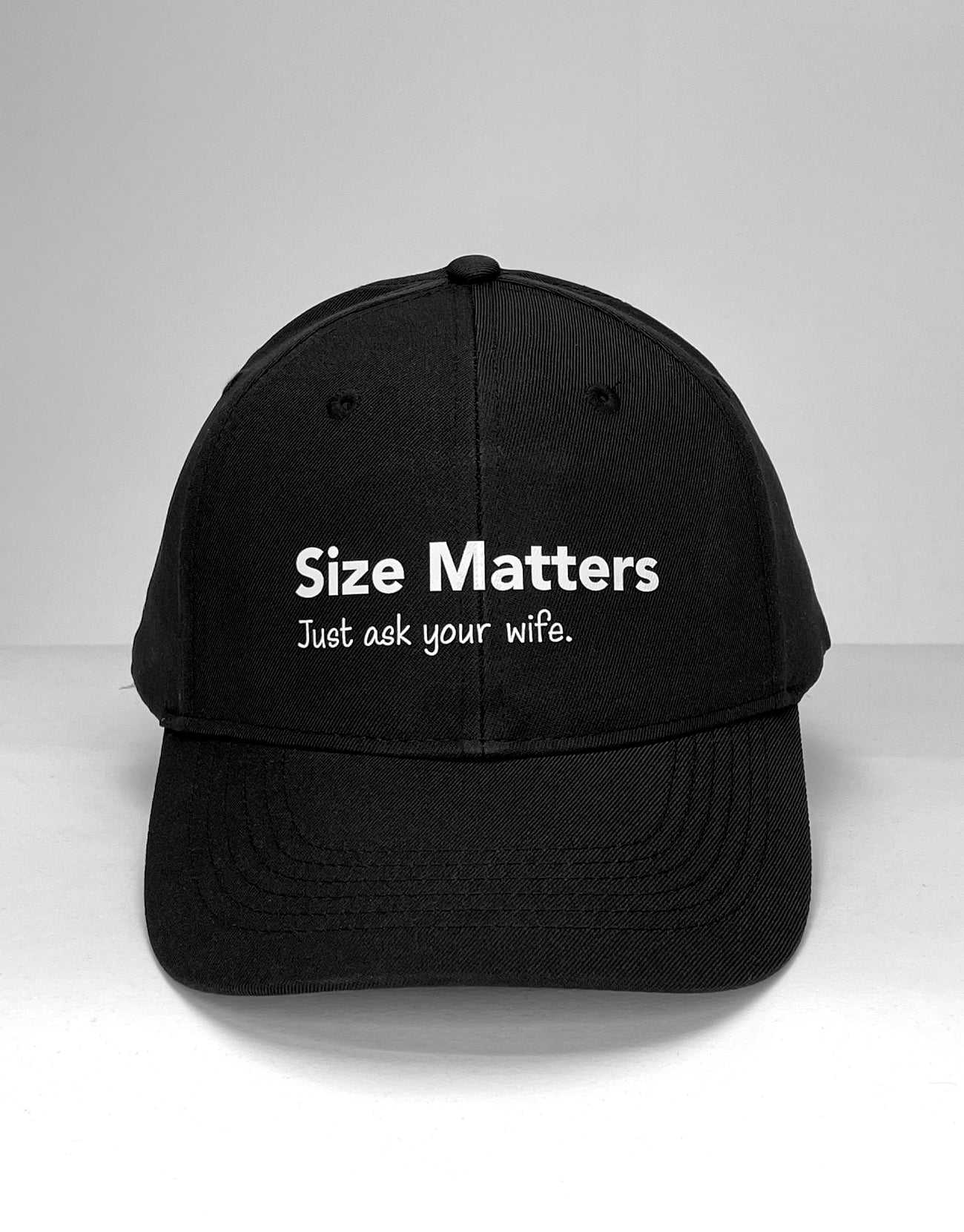 Black wildmant ball cap with white embroidered size matters just ask your wife text on front panel