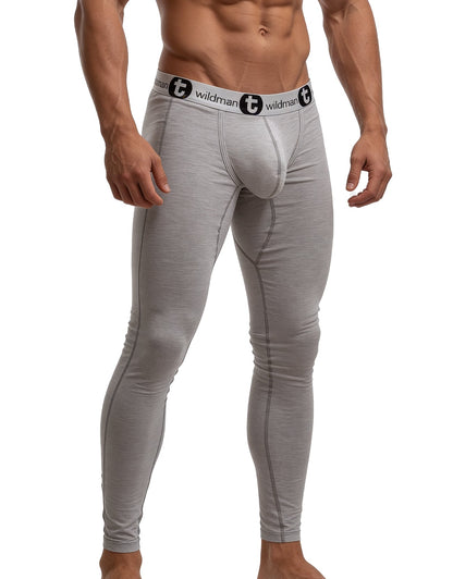 Gray wildman compression tights with white waistband and black logo branding in cotton long johns style