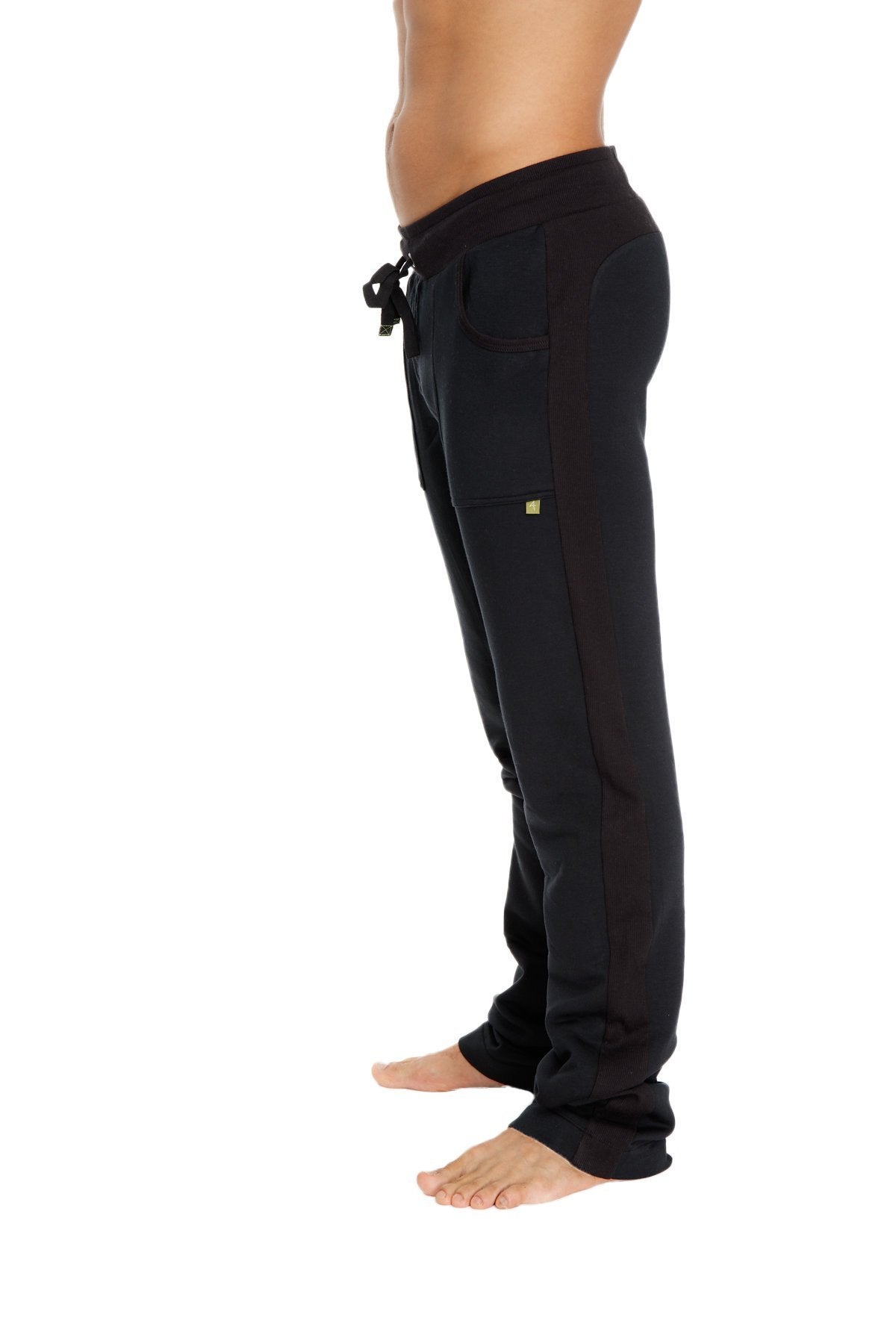 Black mid-weight luxury-fleece sweatpants with drawstring and lime green logo on thigh from winter collection