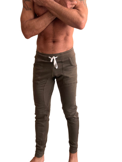 Olive green slim-fit luxury fleece jogger pants with white drawstring side pockets and long cuffs winter edition