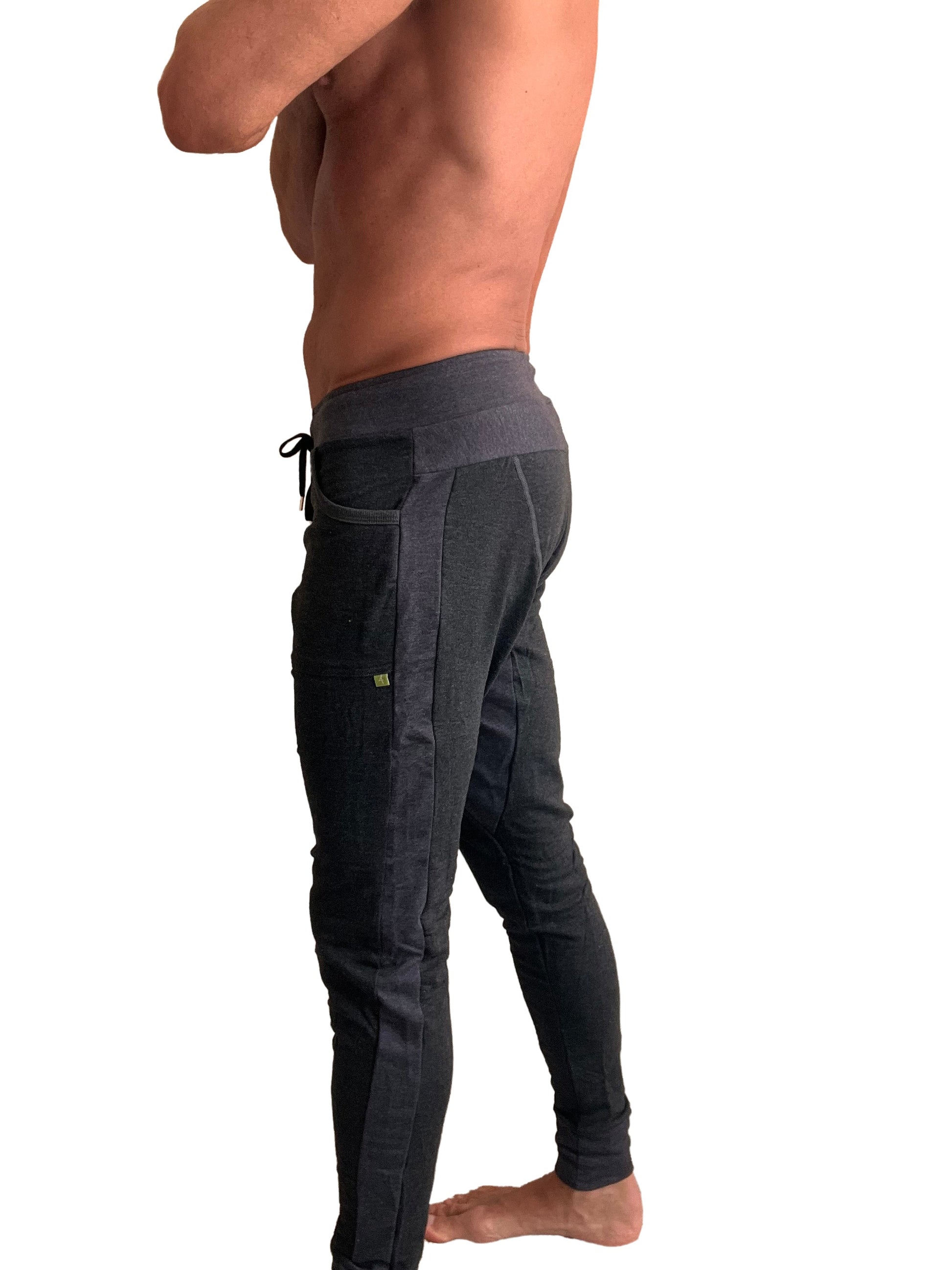 Black athletic joggers with high waisted elastic waistband side pockets and vertical seam detail winter edition fleece pants