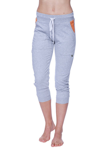 Women’s heather grey 3/4 cuffed capri yoga pants with orange side pockets and white drawstring waistband