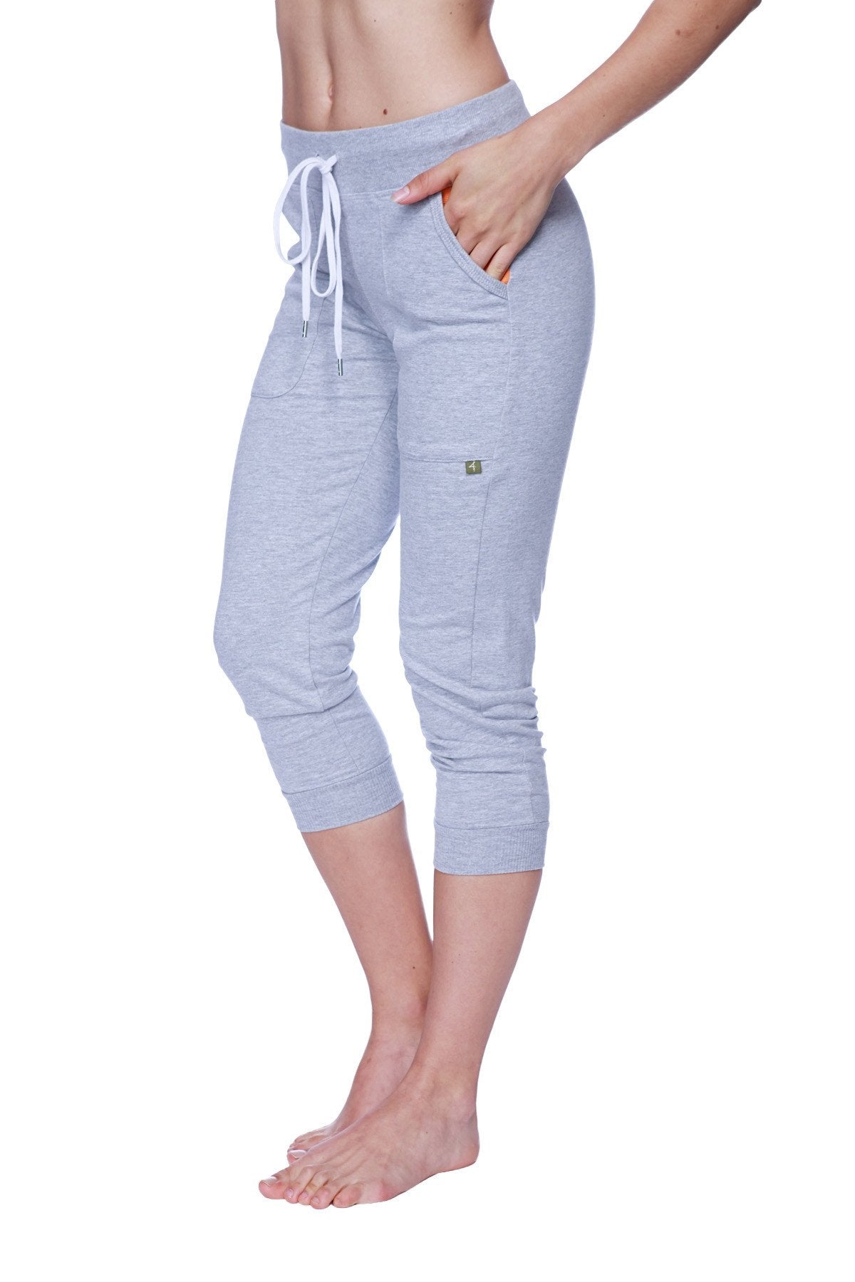Light gray heathered women’s 3/4 cuffed capri yoga pants with white drawstring waistband and side pockets
