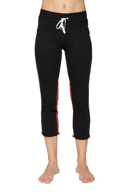 Women’s black 4/5 length capri yoga pants with red side stripes white drawstring waistband and zipper pockets