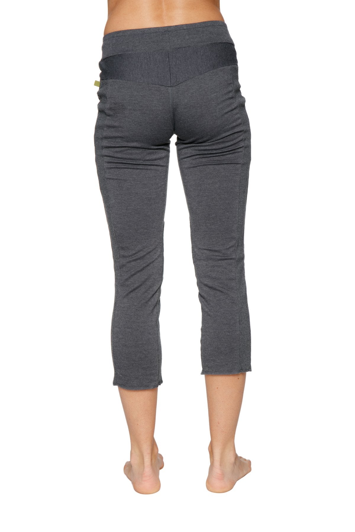 Women’s charcoal 4/5 length capri yoga pants with soft texture and black elastic waistband with zipper pockets
