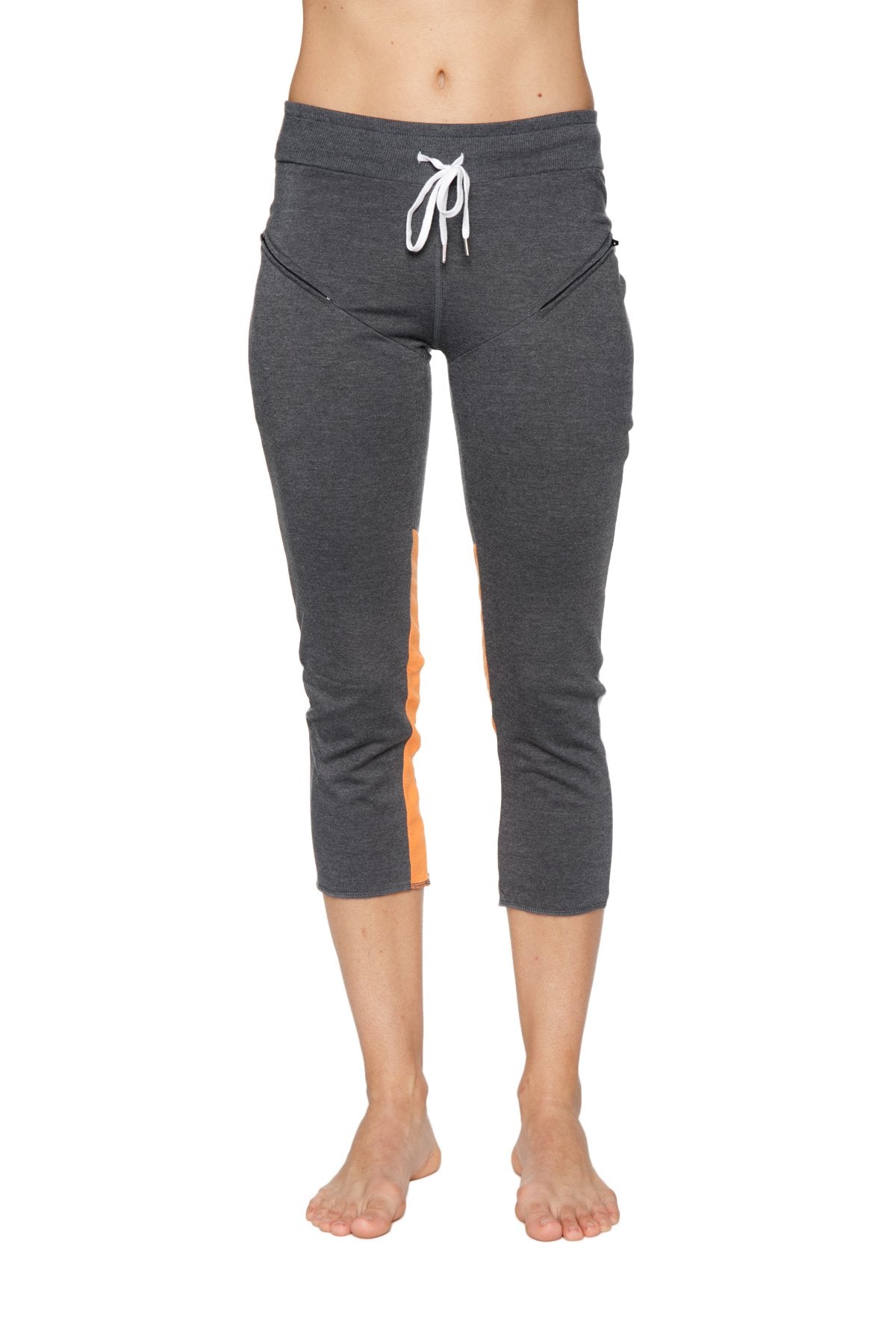 Women’s 4/5 length zipper pocket capri yoga pant in charcoal heathered gray with orange side panels and white drawstring waistband
