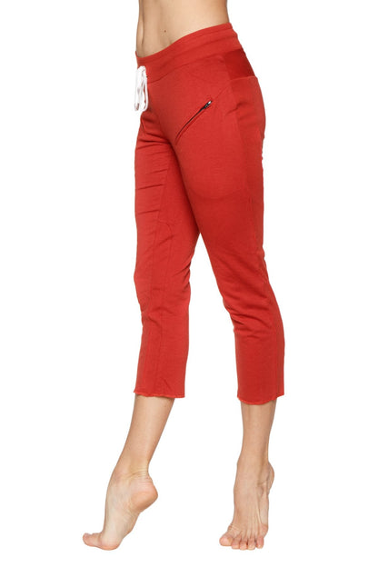 Women’s cinnabar 4/5 length capri yoga pants with white drawstring waistband and zipper pockets