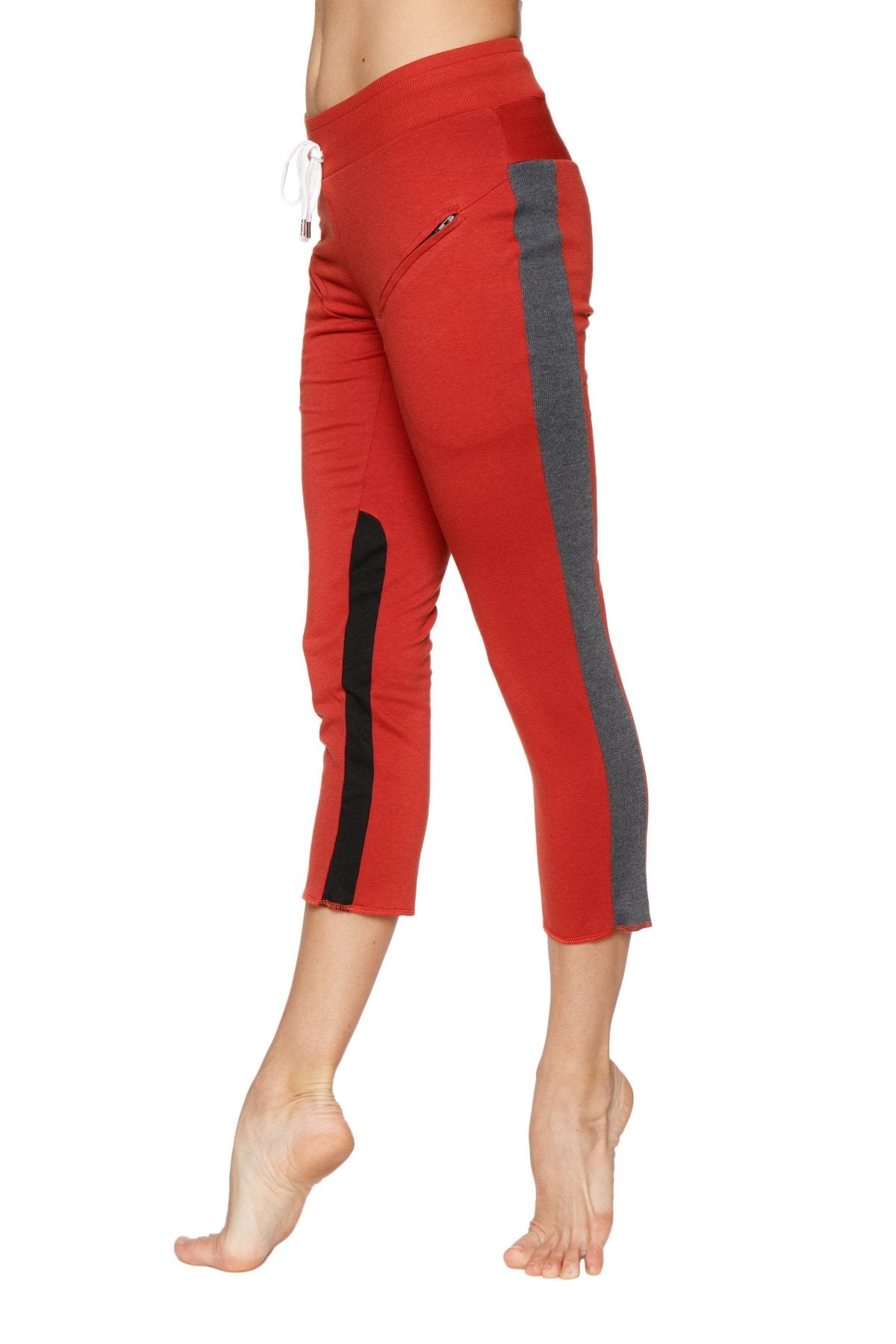 Women’s cinnabar 4/5 length capri yoga pants with gray and black side stripe and white drawstring waistband