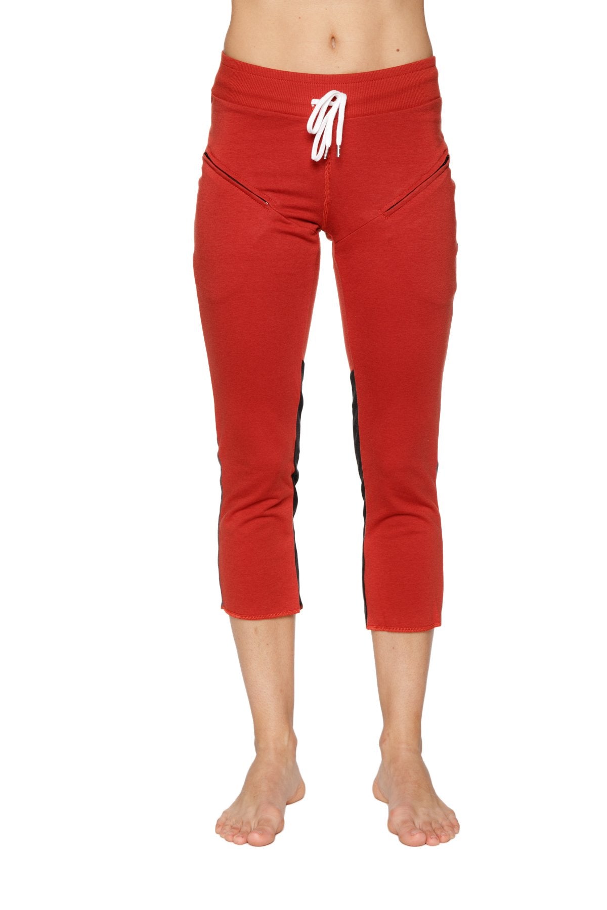 Women’s cinnabar capri yoga pants with black side stripes white drawstring waistband and zipper pockets