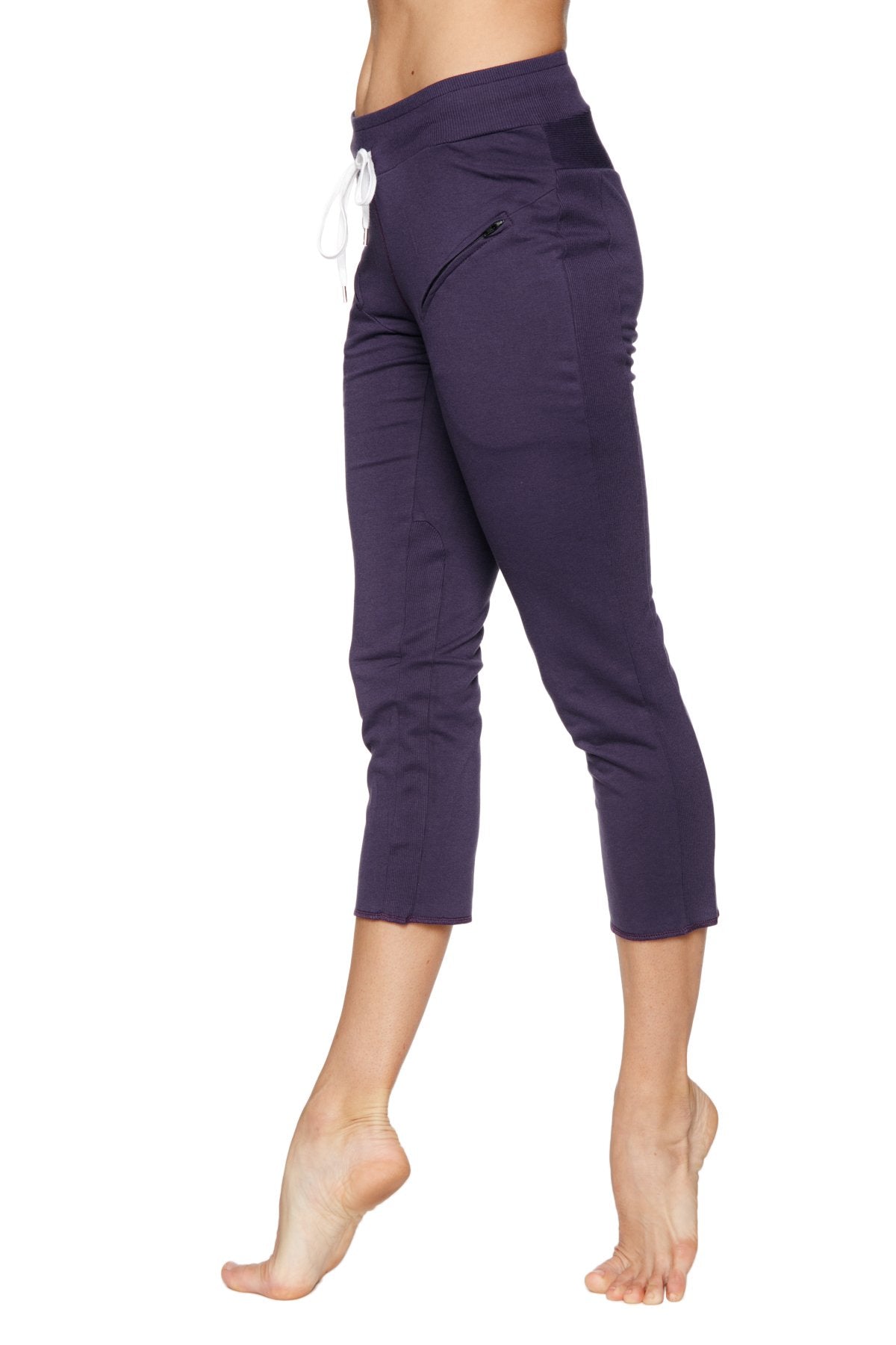 Navy blue high-waisted 4/5 length capri yoga pants with white drawstring and side zipper pockets for women