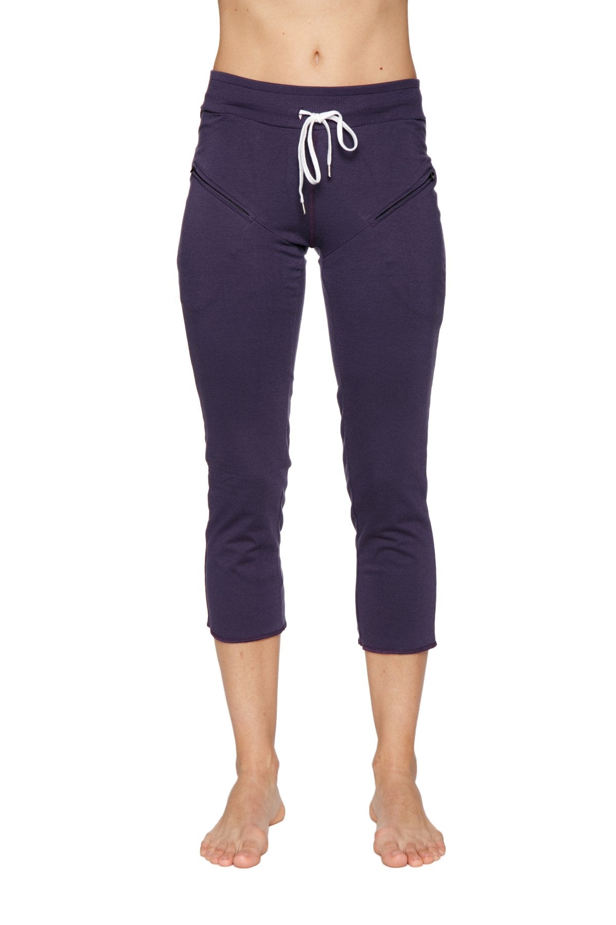 Women’s navy blue capri yoga pants with white drawstring waistband and side pockets for active wear